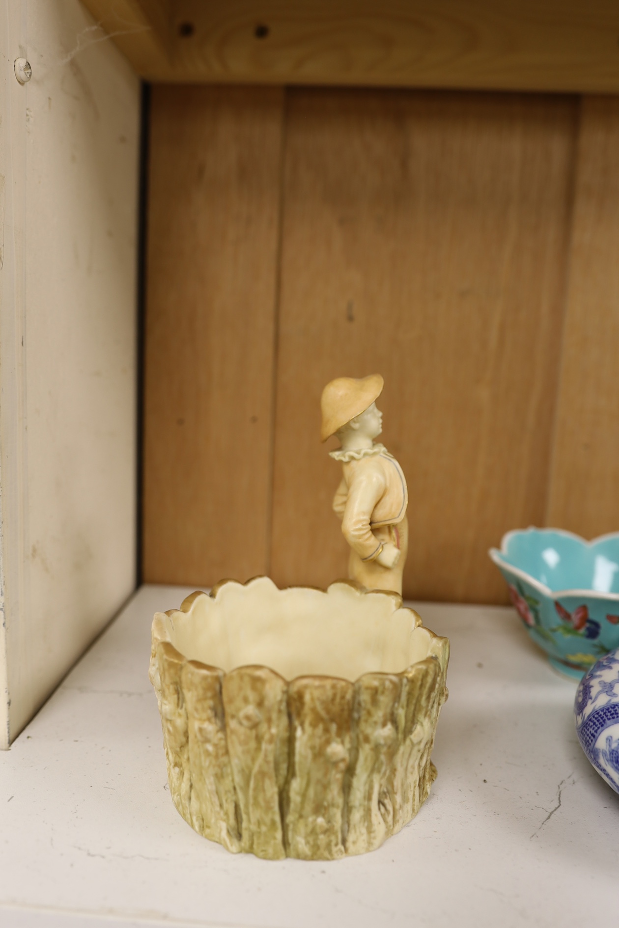 A Royal Worcester blush ivory figural pot, model no. 1242, 14.5cm high. Condition - fair to good